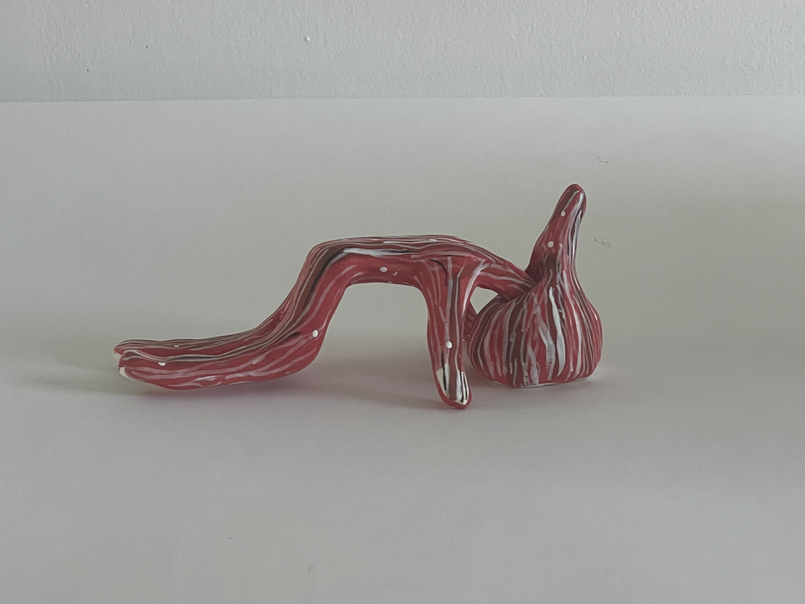 Untitled, 2022. Acrylic on ceramic, 2 x 6-1/2 x 4 inches.