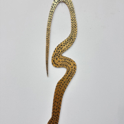 Mapanare Gold, 2024. Acrylic on aluminum composite material (ACM), 32 x 7 inches.