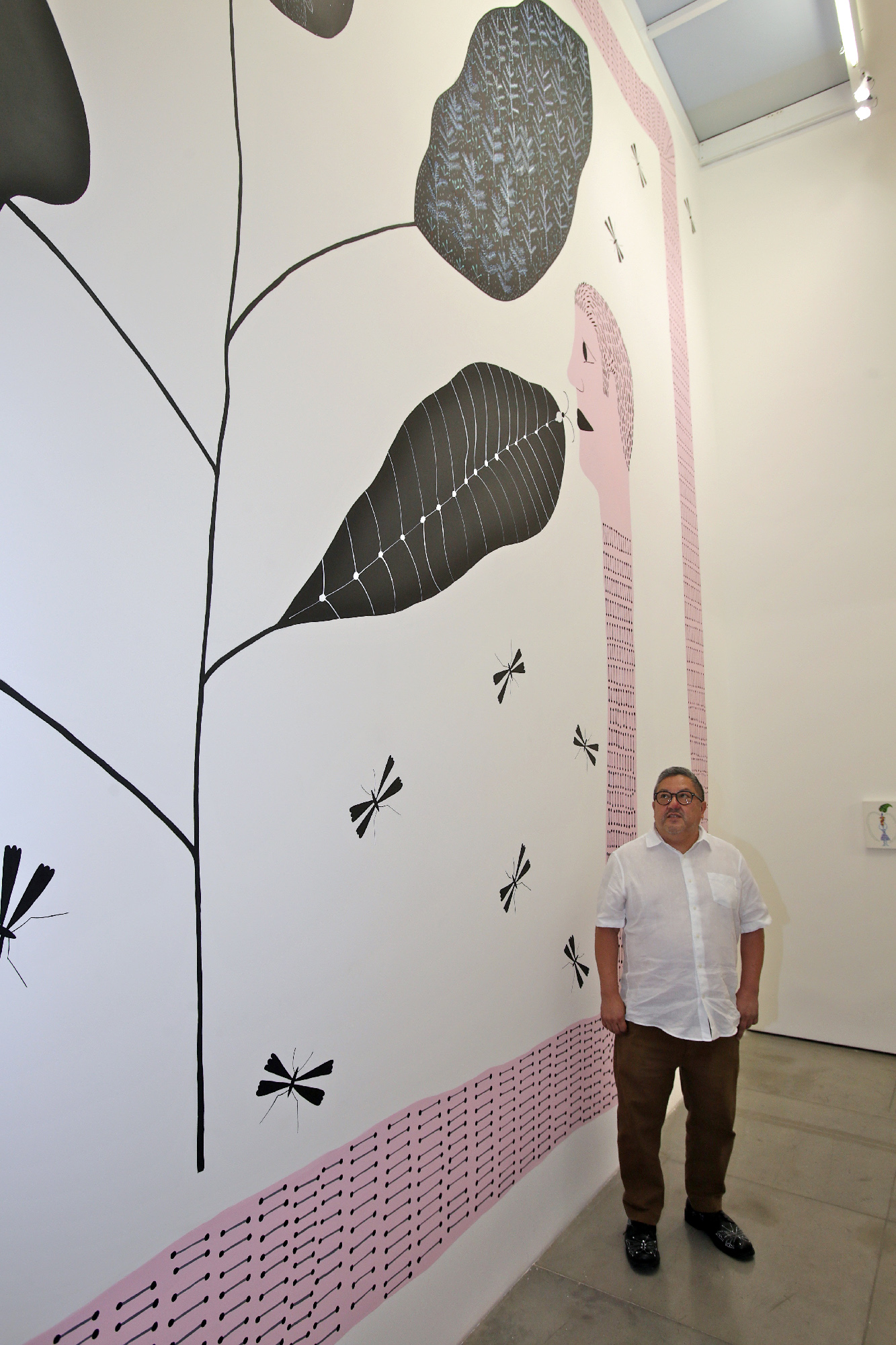 Courtyard, 2024 (artist portrait). Acrylic on wall, 196 x 295 inches.